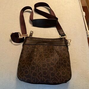 Calvin Klein brown signature cross body bag, used a couple of times. Like new!